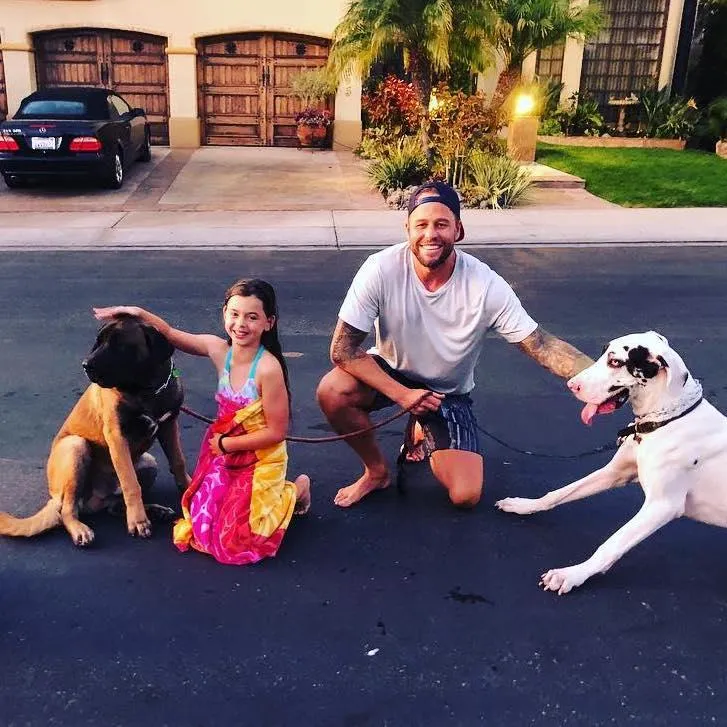 Brian MacDonald with his daughter and dogs at home in Orange County, California